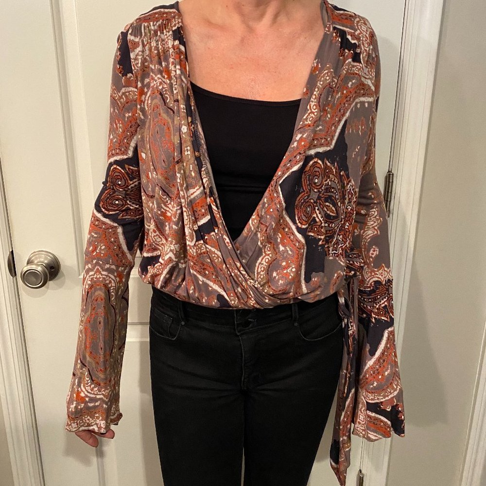 Woman’s Free People Faux Wrap Top Size Med.